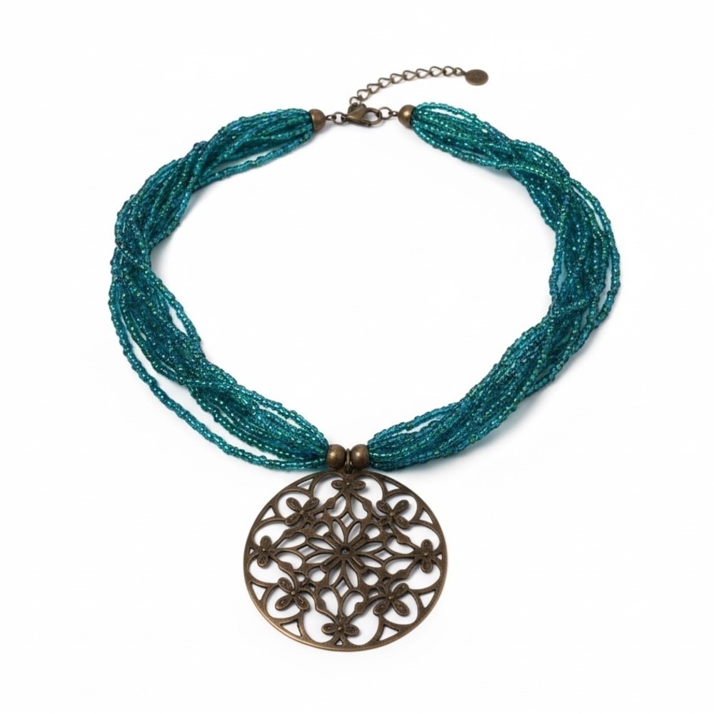 Vintage turquoise blue beaded necklace with gold tone floral medallion